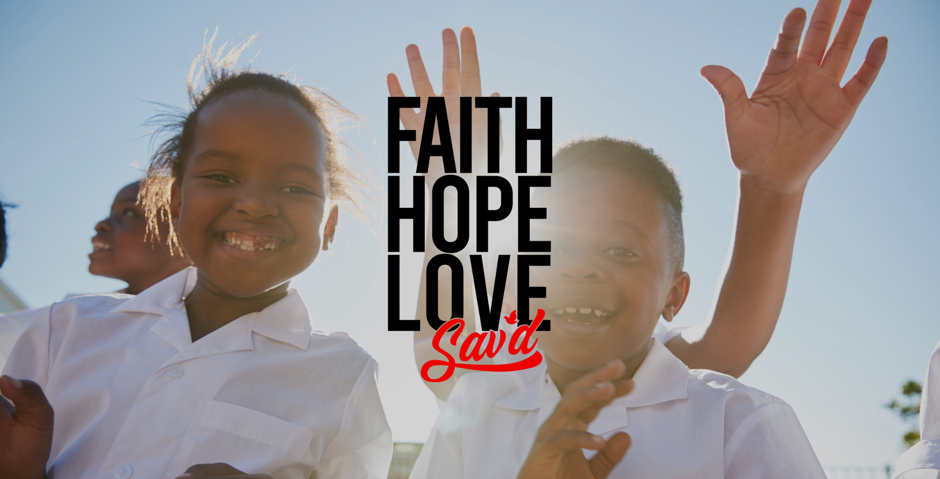 Inspirational image of children holding hands UP, symbolizing faith, love, and hope, with joyful expressions in a playground setting.